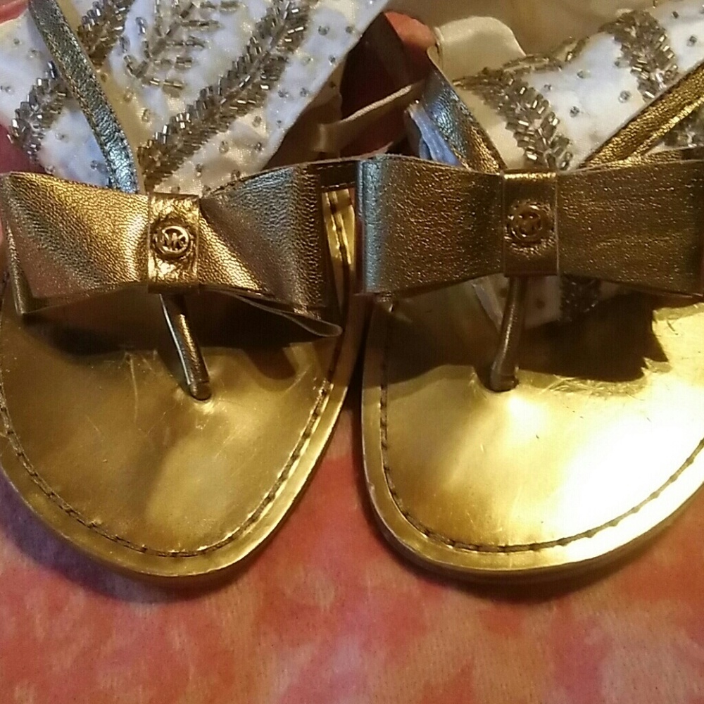 9M Michael by Michael Kors Gold Thong Sandals.